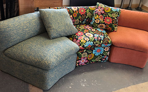 A sectional sofa with different fabric for each piece
